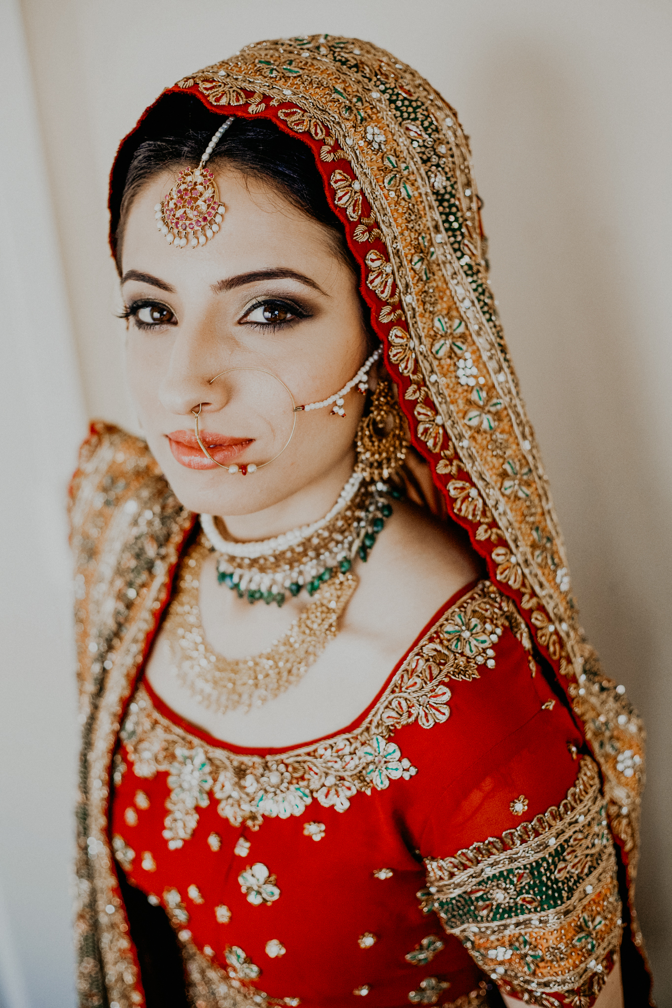Portrait of Indian bride in red and gold dress