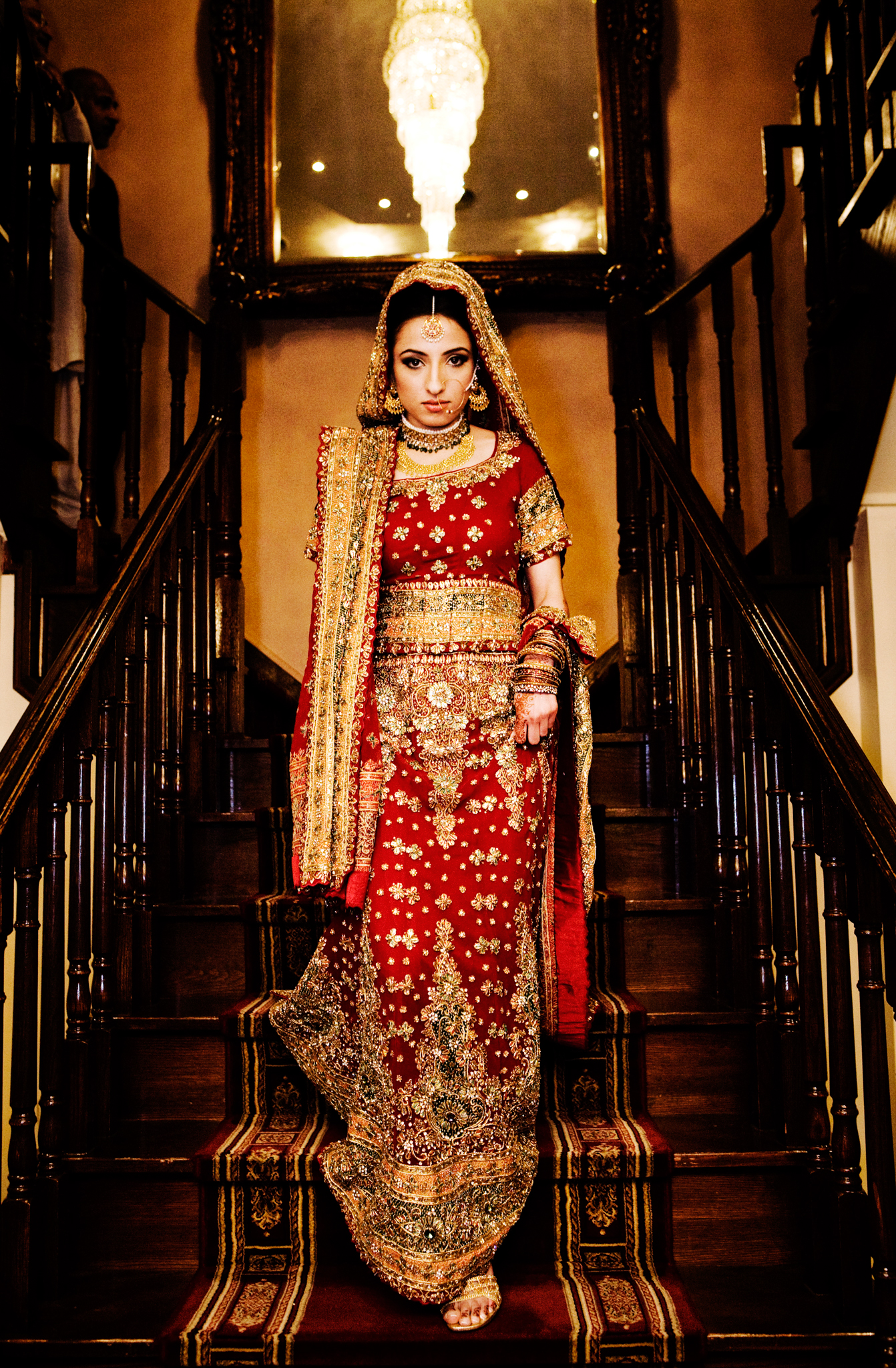 Mehndi bride on stairs Muslim wedding MN documentary wedding photographer