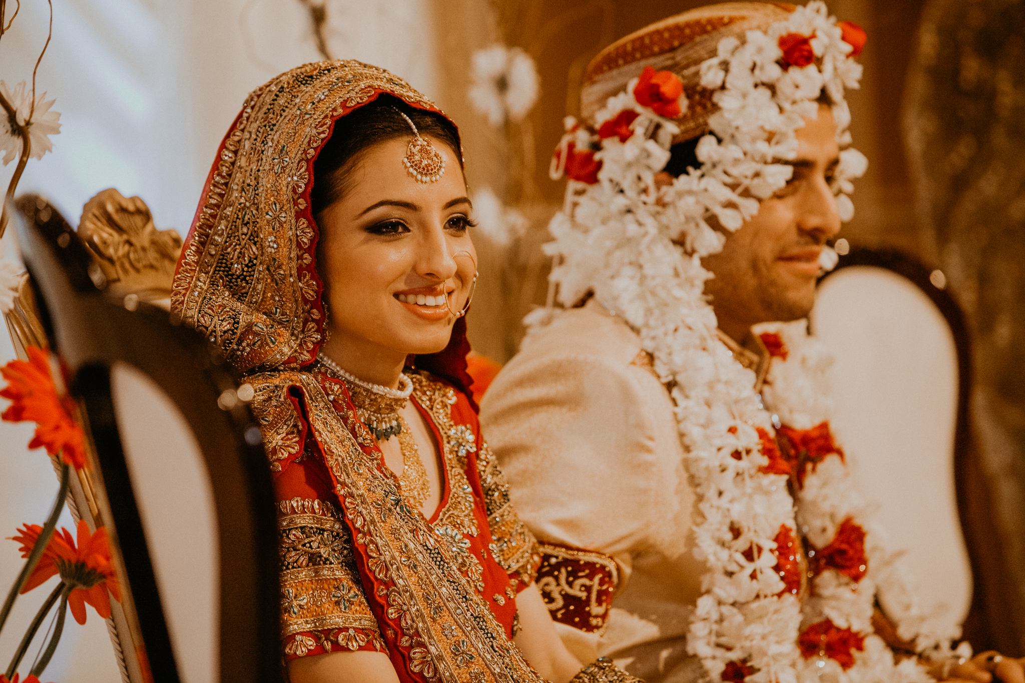 Indian bride and groom listen to speeches at Indian Mehndi wedding MN documentary photographer