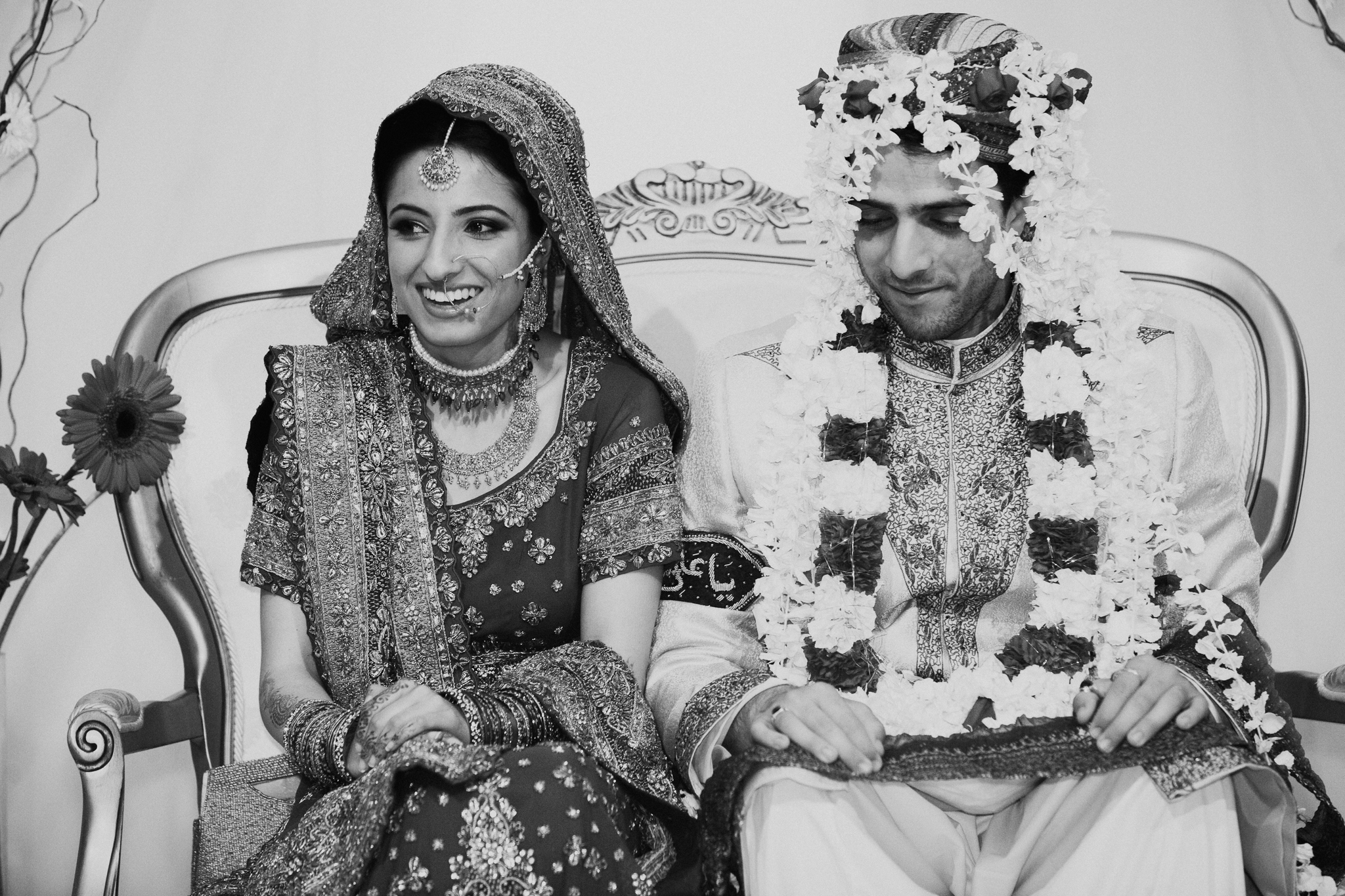 Indian bride and groom laugh during speeches at Indian Mehndi wedding MN documentary photographer