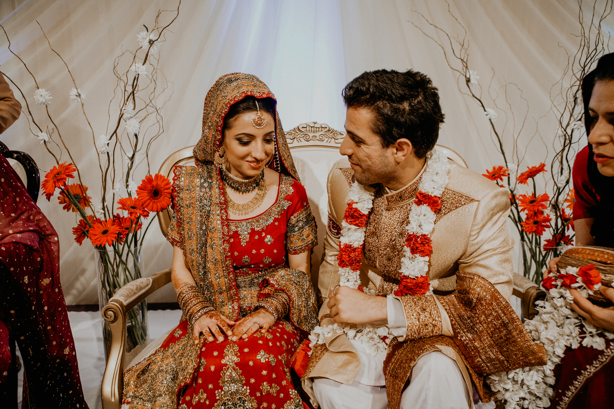 Bride and groom exchange rings at Mehndi ceremony Indian wedding photograph Minneapolis MN