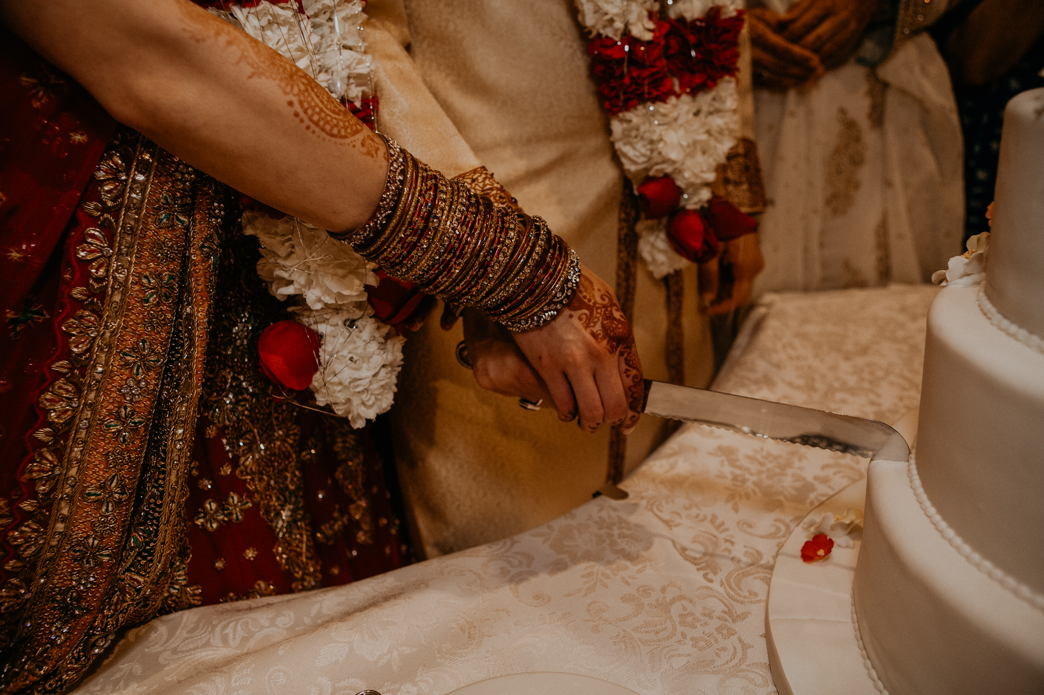 Bride and groom each cake at Mehndi Indian Islamic wedding MN documentary photograph