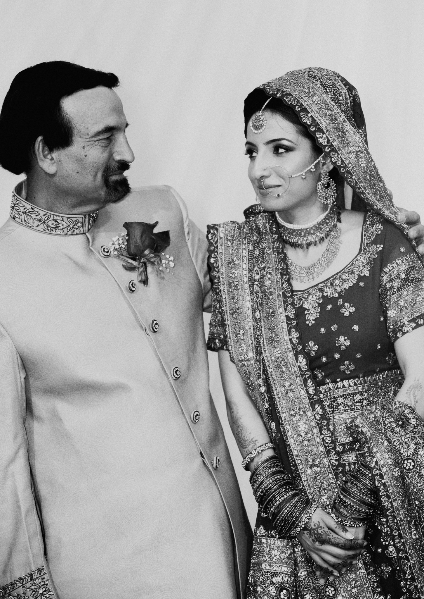 Candid portrait of father and bride at Mehndi Indian wedding 