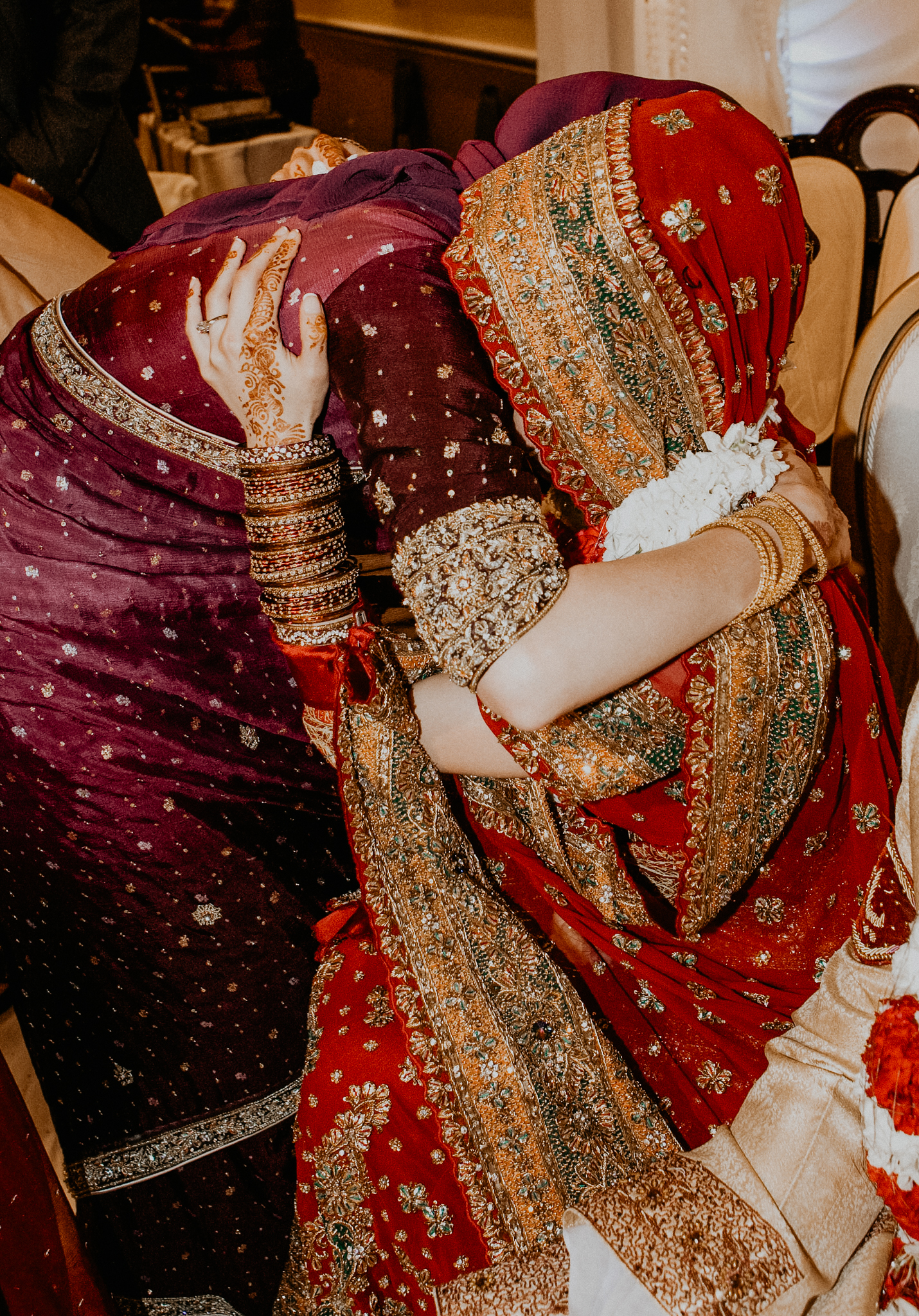 Sister hugs bride at Indian wedding MN Indian wedding photo