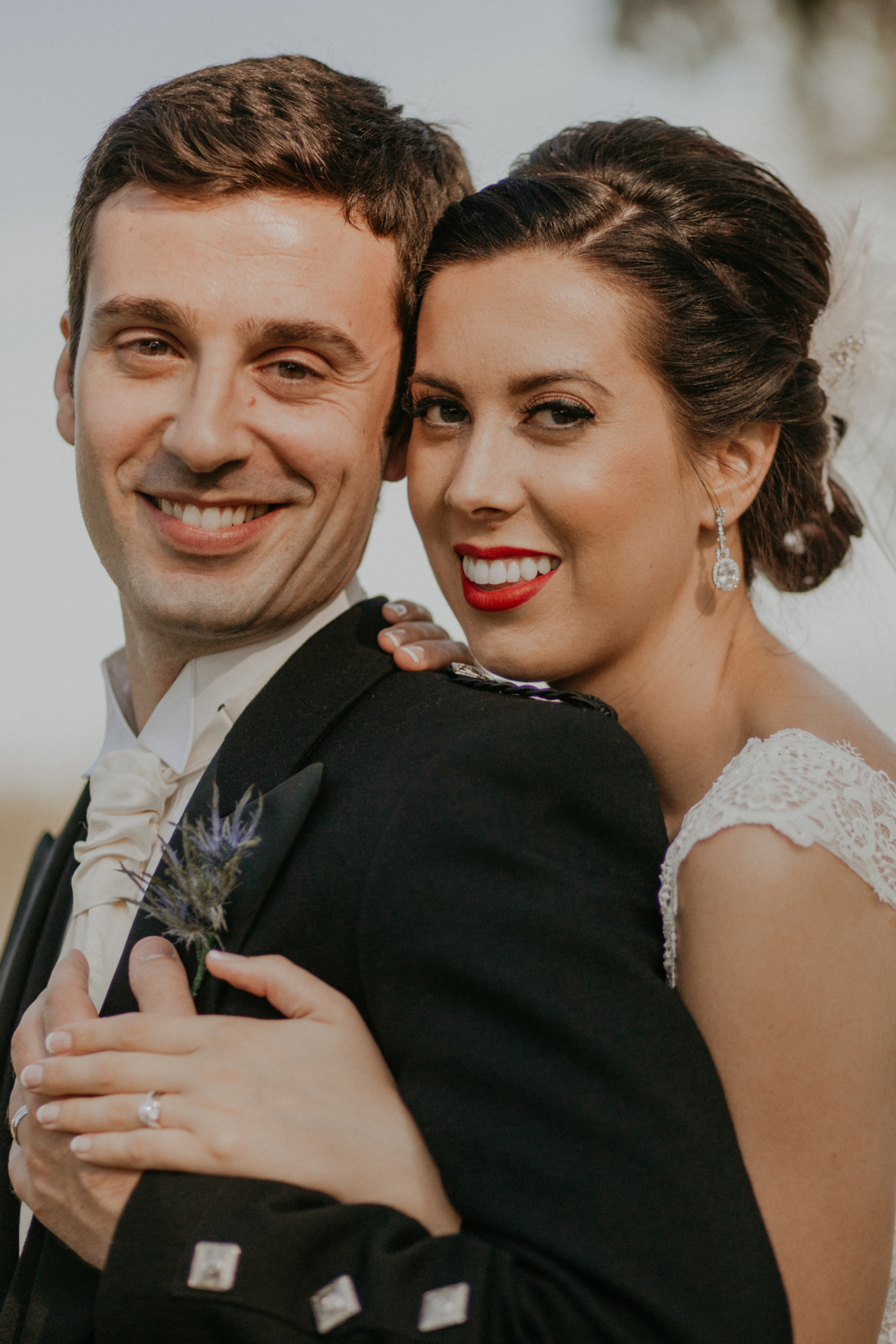 Portrait of bride and groom smiling close up romantic wedding photograph