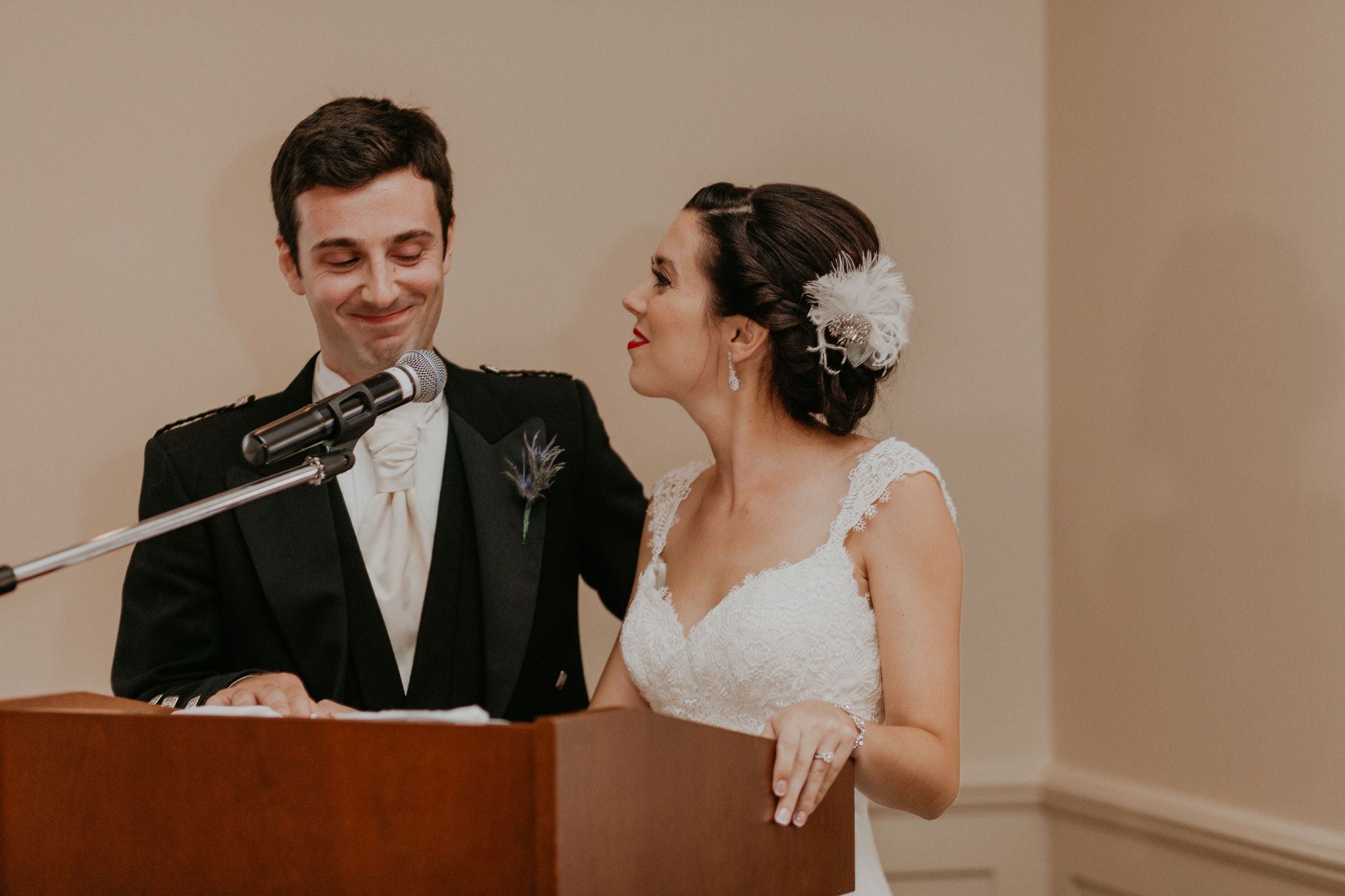 Bride and groom make toast at wedding reception