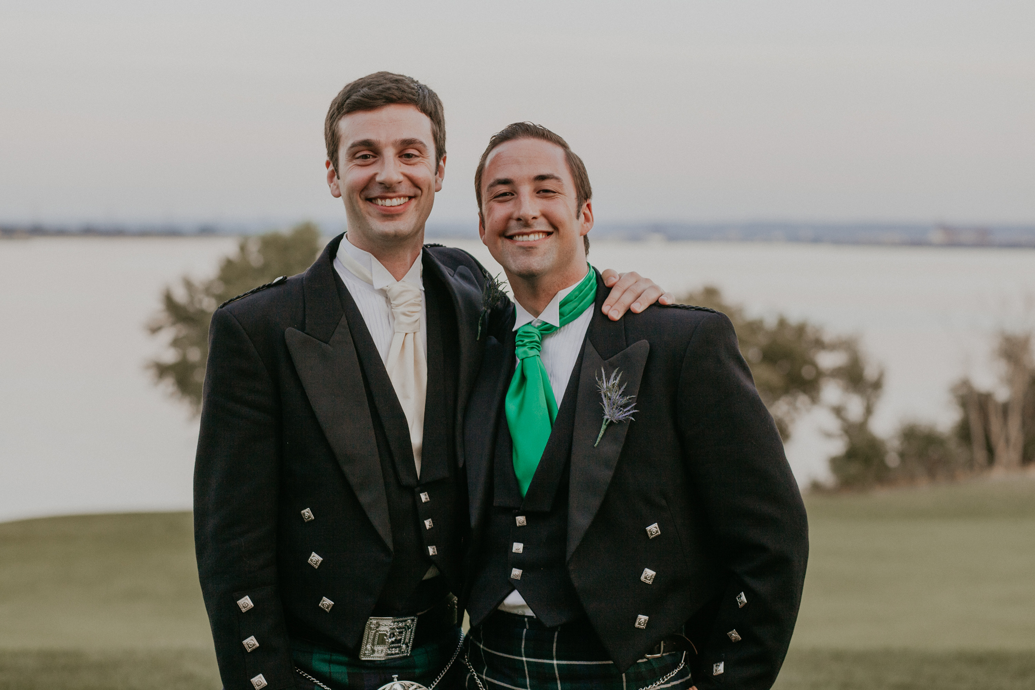 Portrait of groom with best man smiling