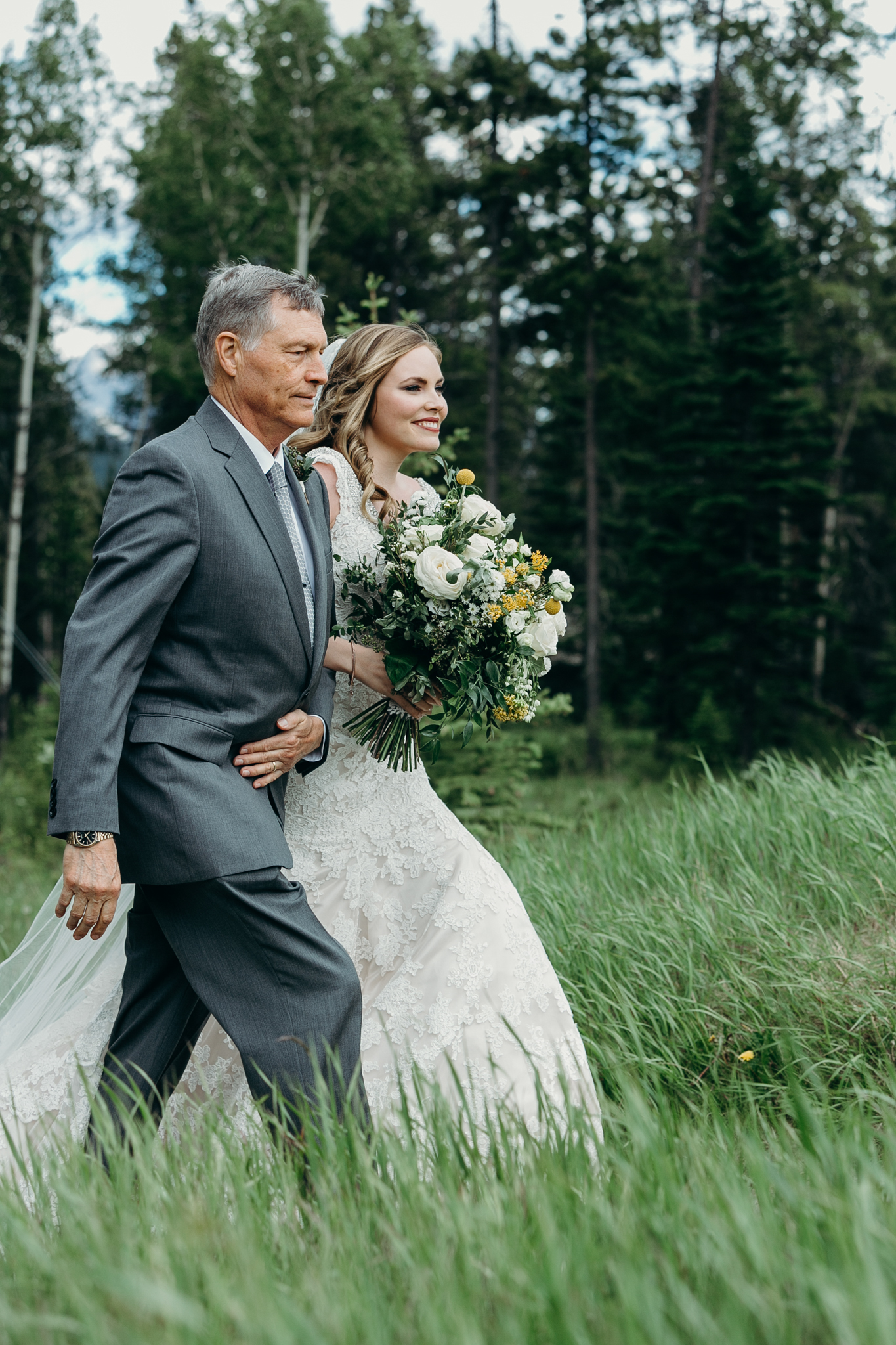 Father walks bride down aisle at Silvertip Resort Canmore AB wedding