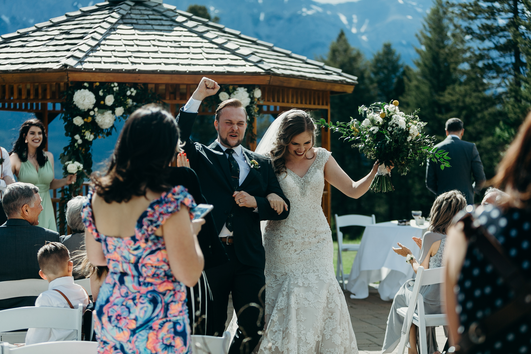 Bride and groom celebrate Wedding ceremony at gazebo Silvertip Resort Canmore AB rocky mountain wedding