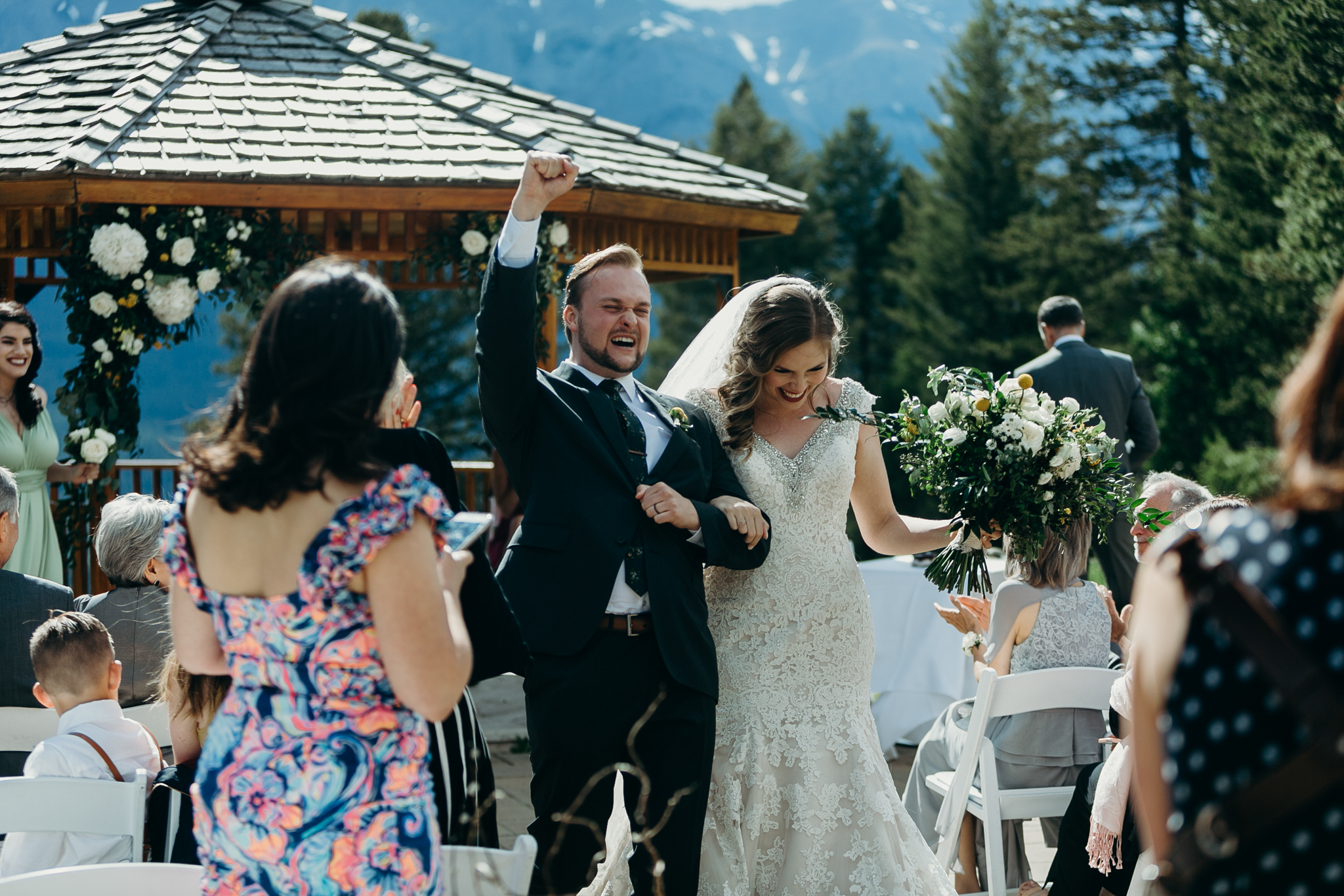Bride and groom celebrate Wedding ceremony at gazebo Silvertip Resort Canmore AB rocky mountain wedding
