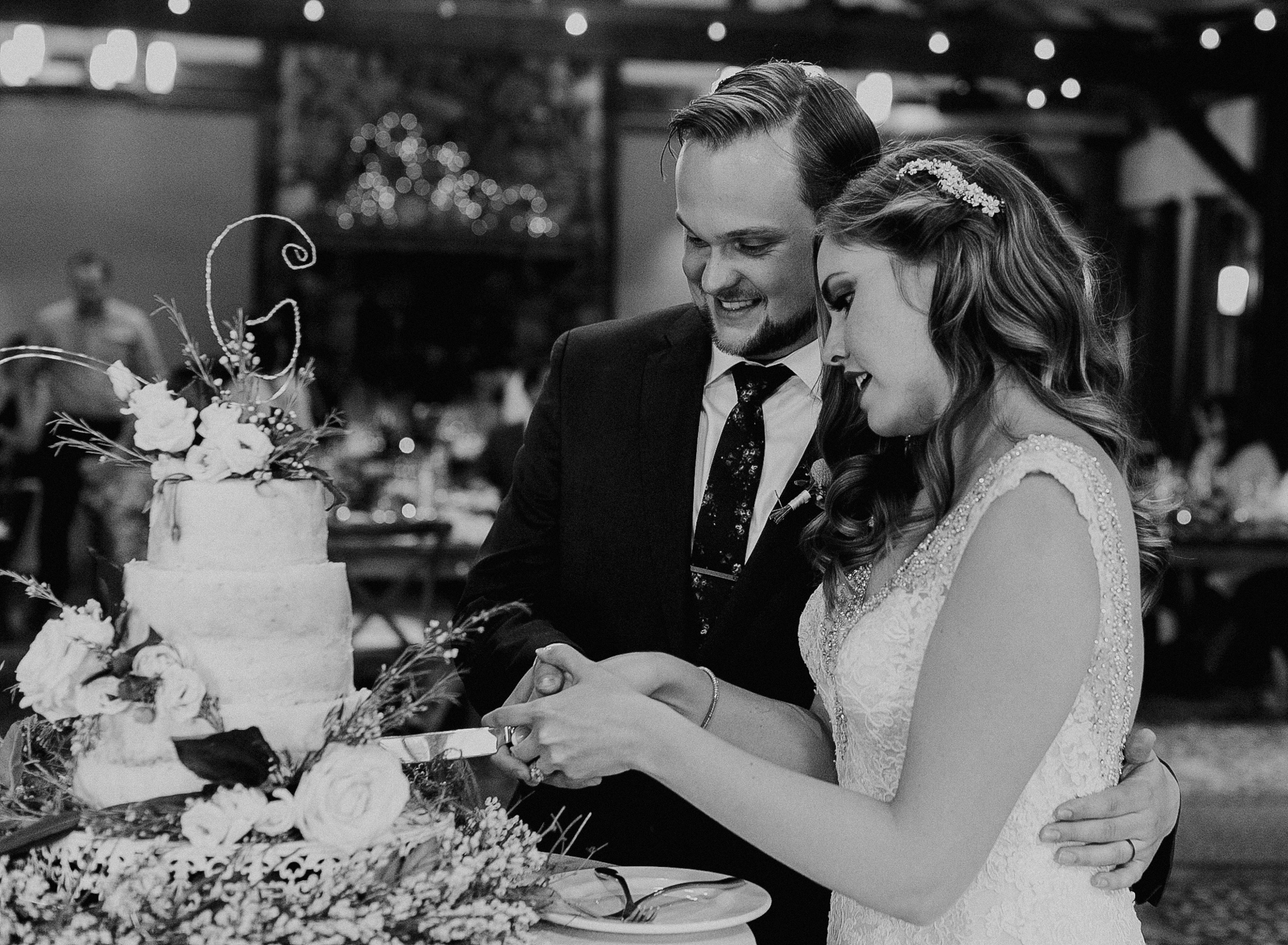 Bride and groom cut cake at Silvertip Resort Wedding reception