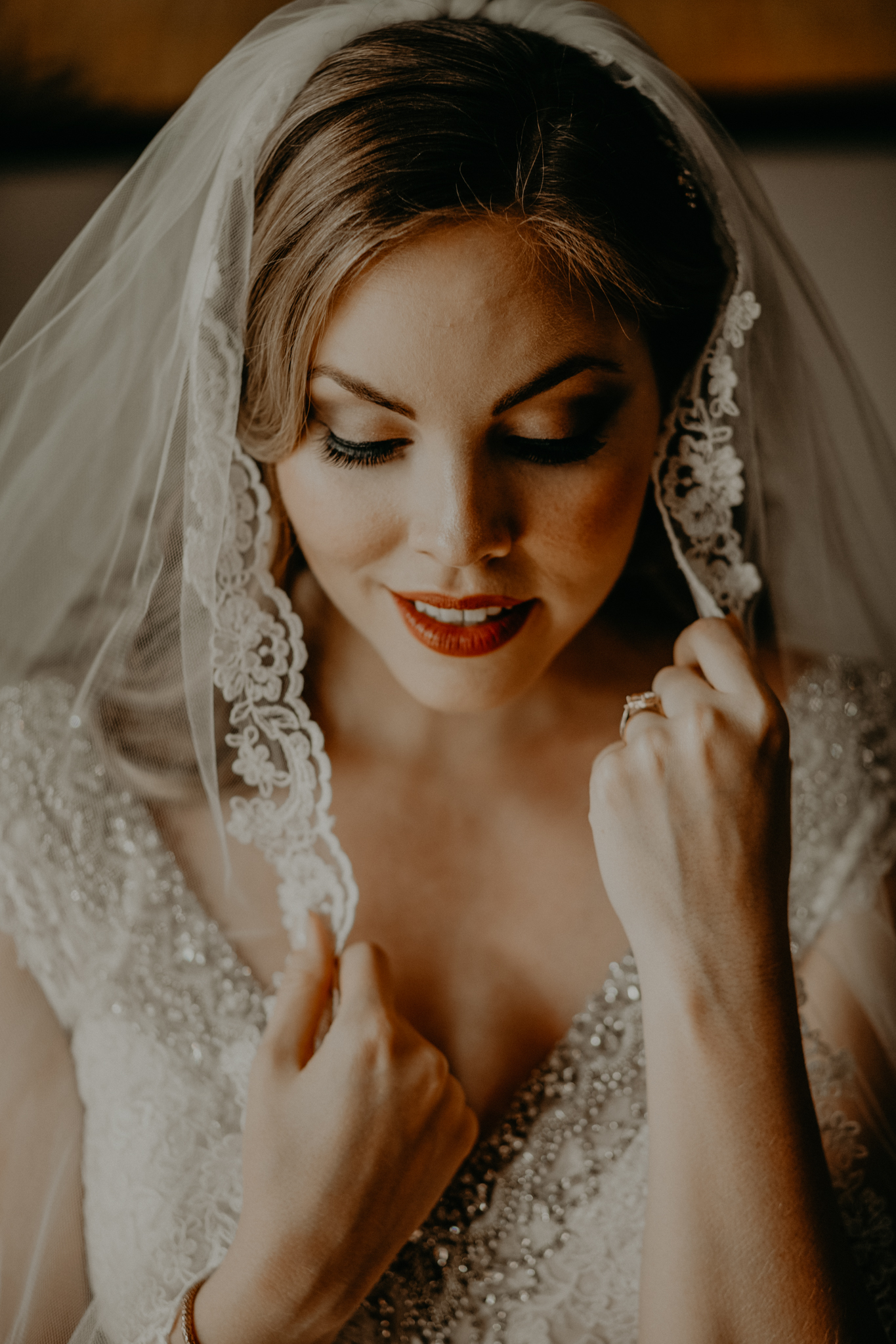 Portrait of bride touching veil MN wedding photographer