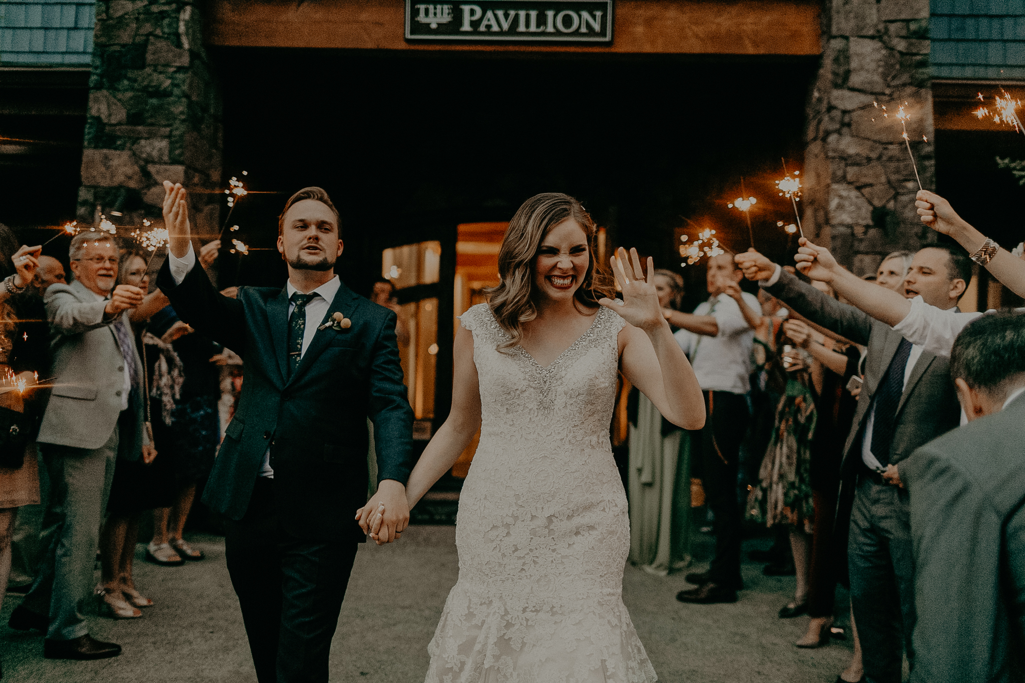 documentary wedding photograph of bride and groom leaving reception