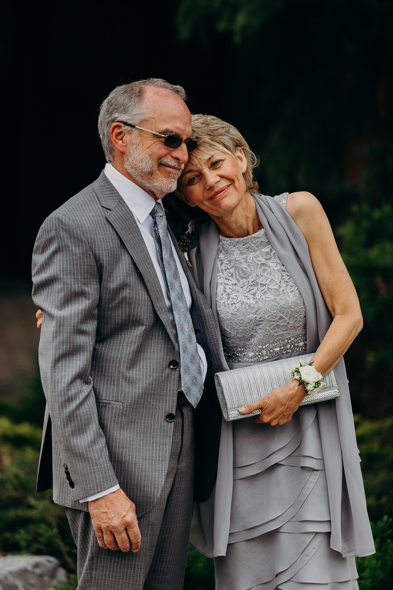 Candid photo of mother and father of groom destination wedding canmore