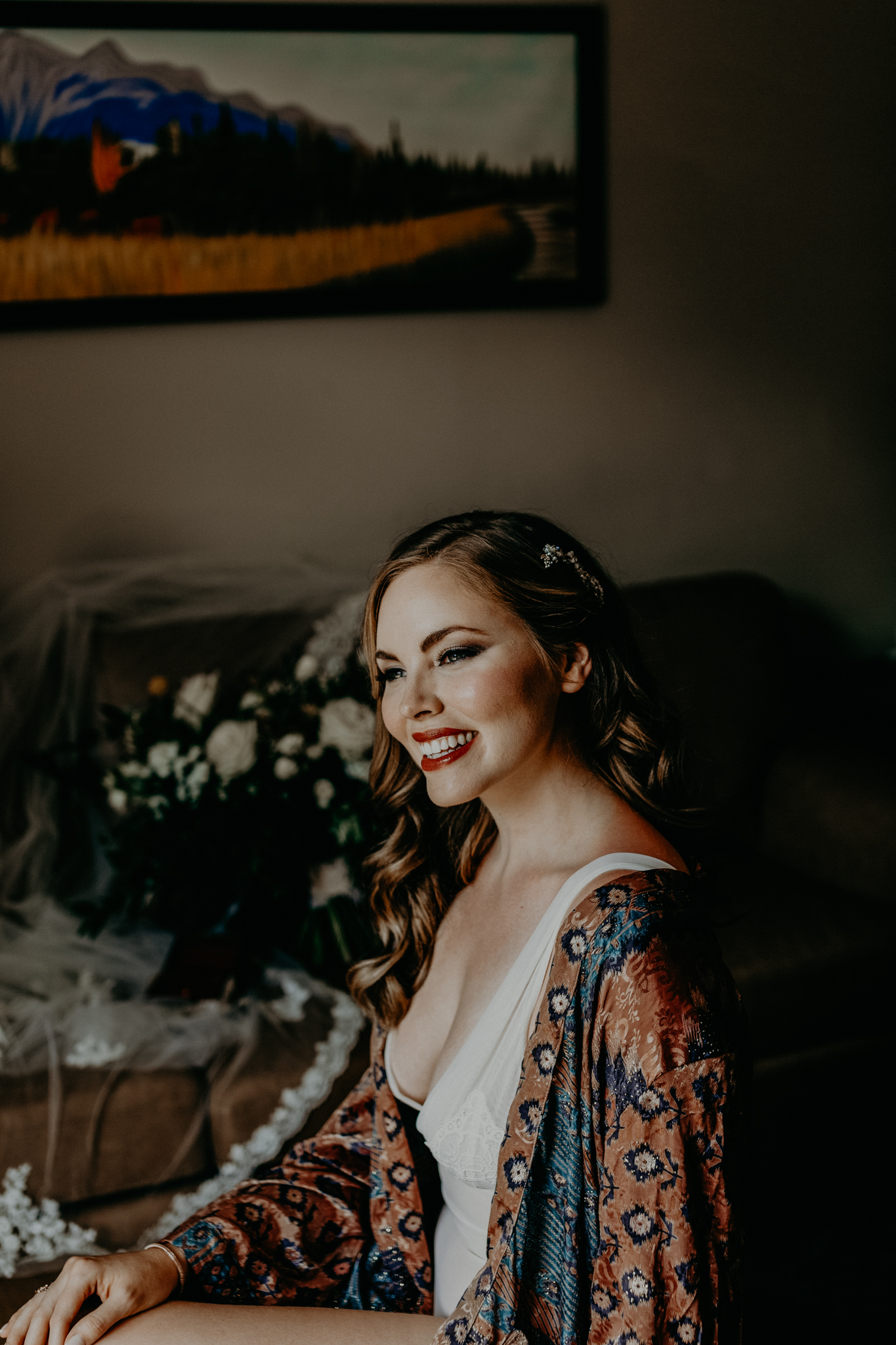 Bride smiling while getting ready