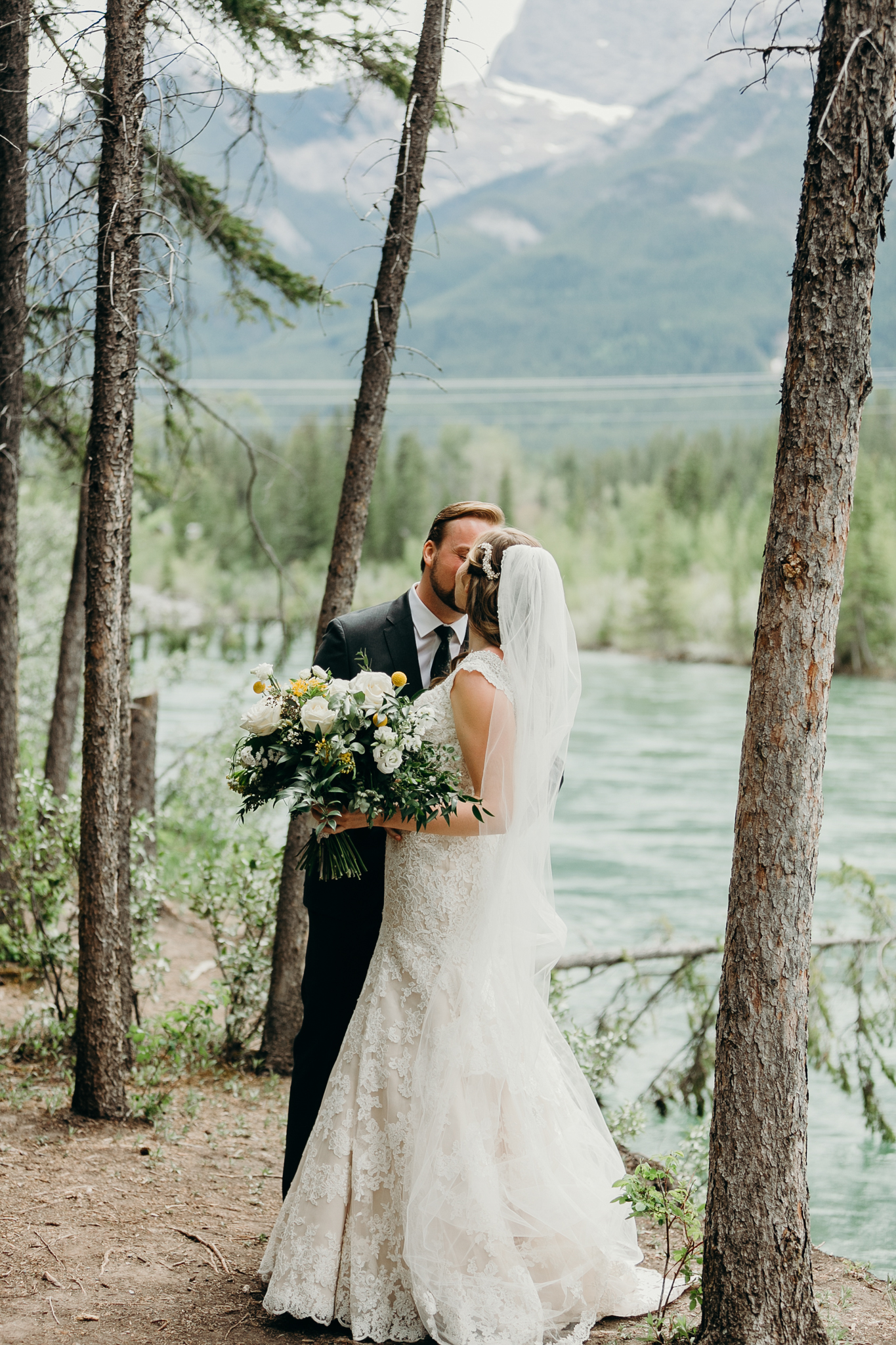 Bride and groom embrace romantic wedding photography MN destination wedding photographer Canmore AB