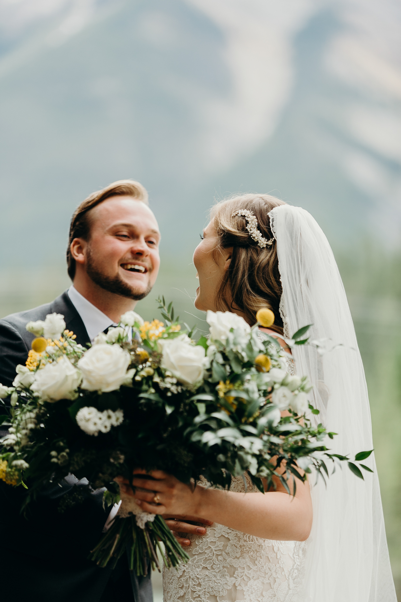 Bride and groom embrace romantic wedding photography MN destination wedding photographer Canmore AB